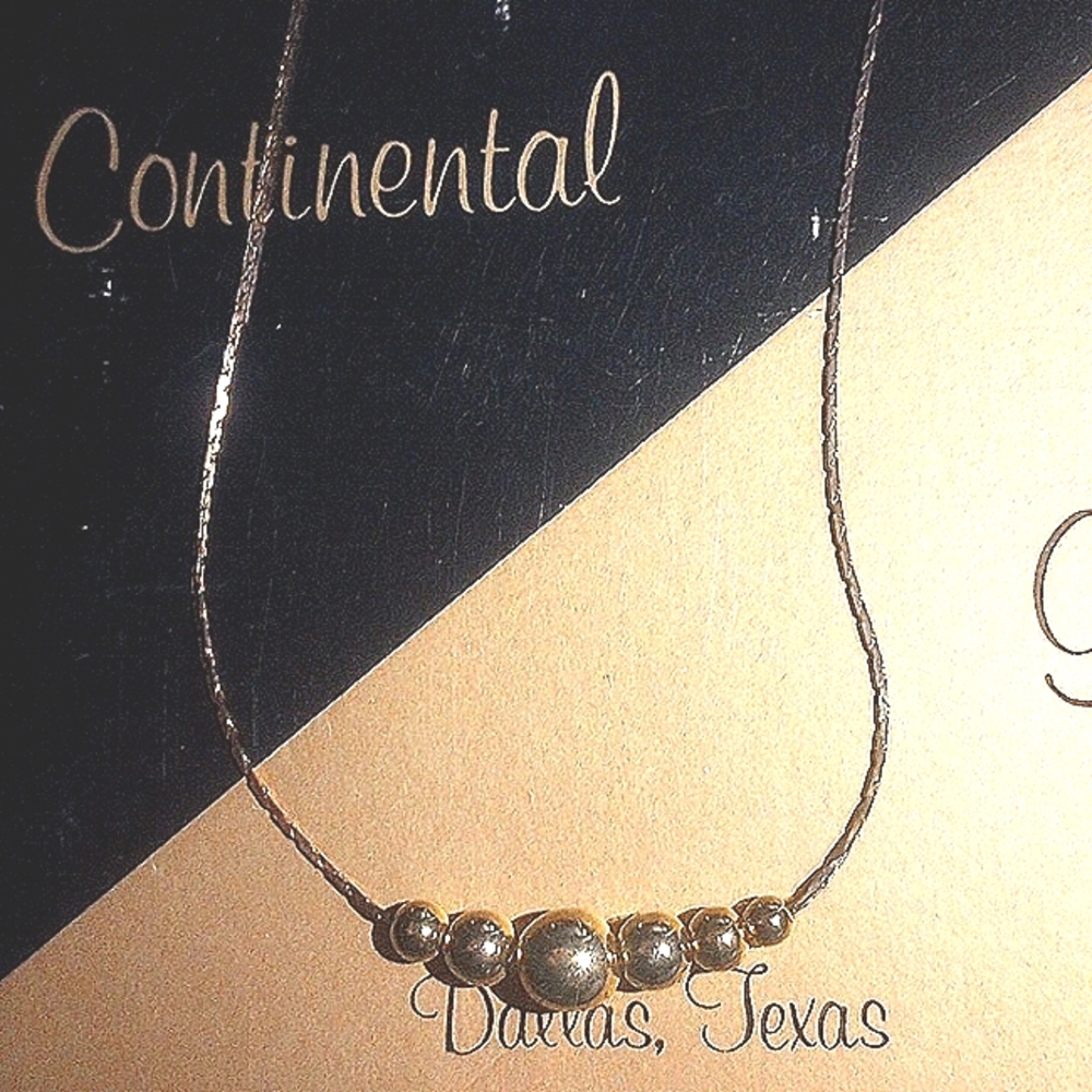 Continental gold necklace